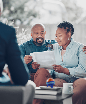 man and a woman looking at paperwork